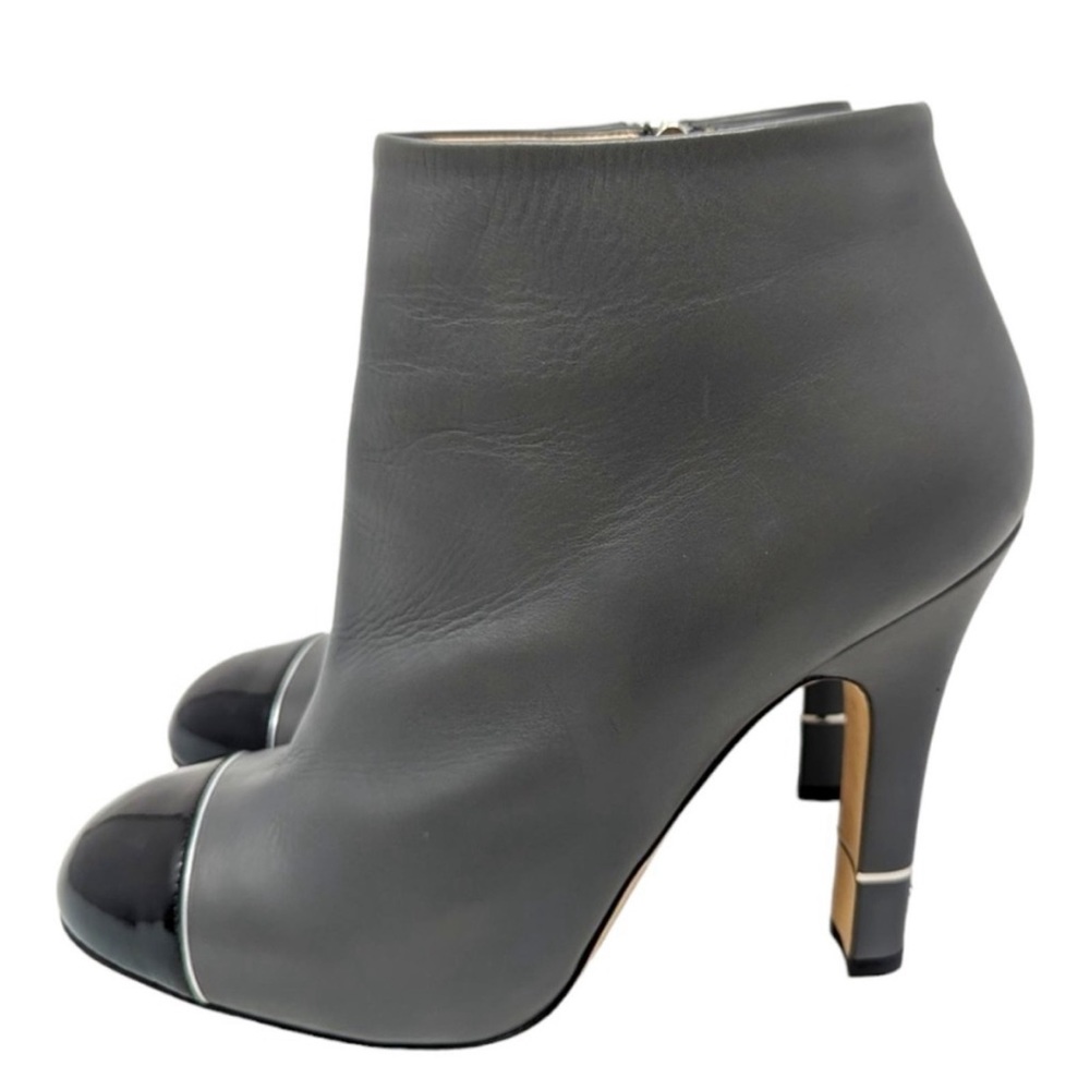 CHANEL ankle boot grey leather with black patent toe & CC logo on back of heel.